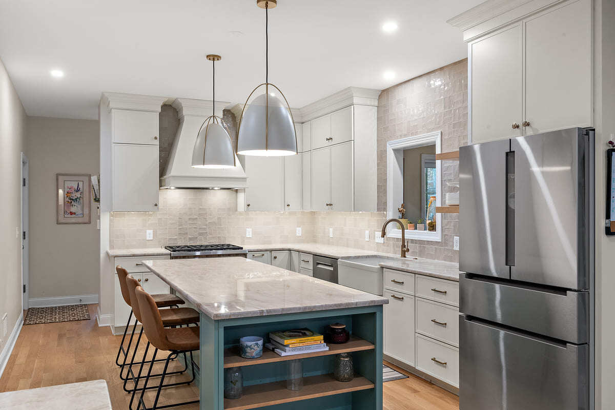 Island with pendant lighting above and seating in Delaware kitchen remodel by Bromwell Construction