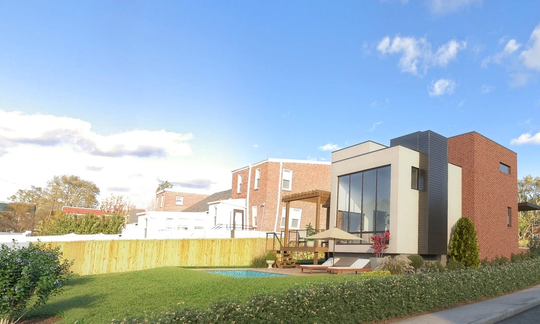 Backyard of new construction home on sunny day with pool by Bromwell Construction