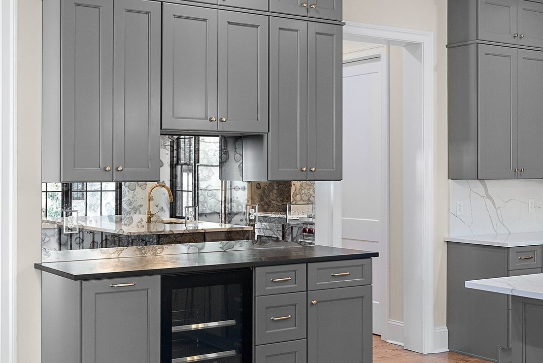 Kitchen bar with beverage fridge in Delaware custom home by Bromwell Construction