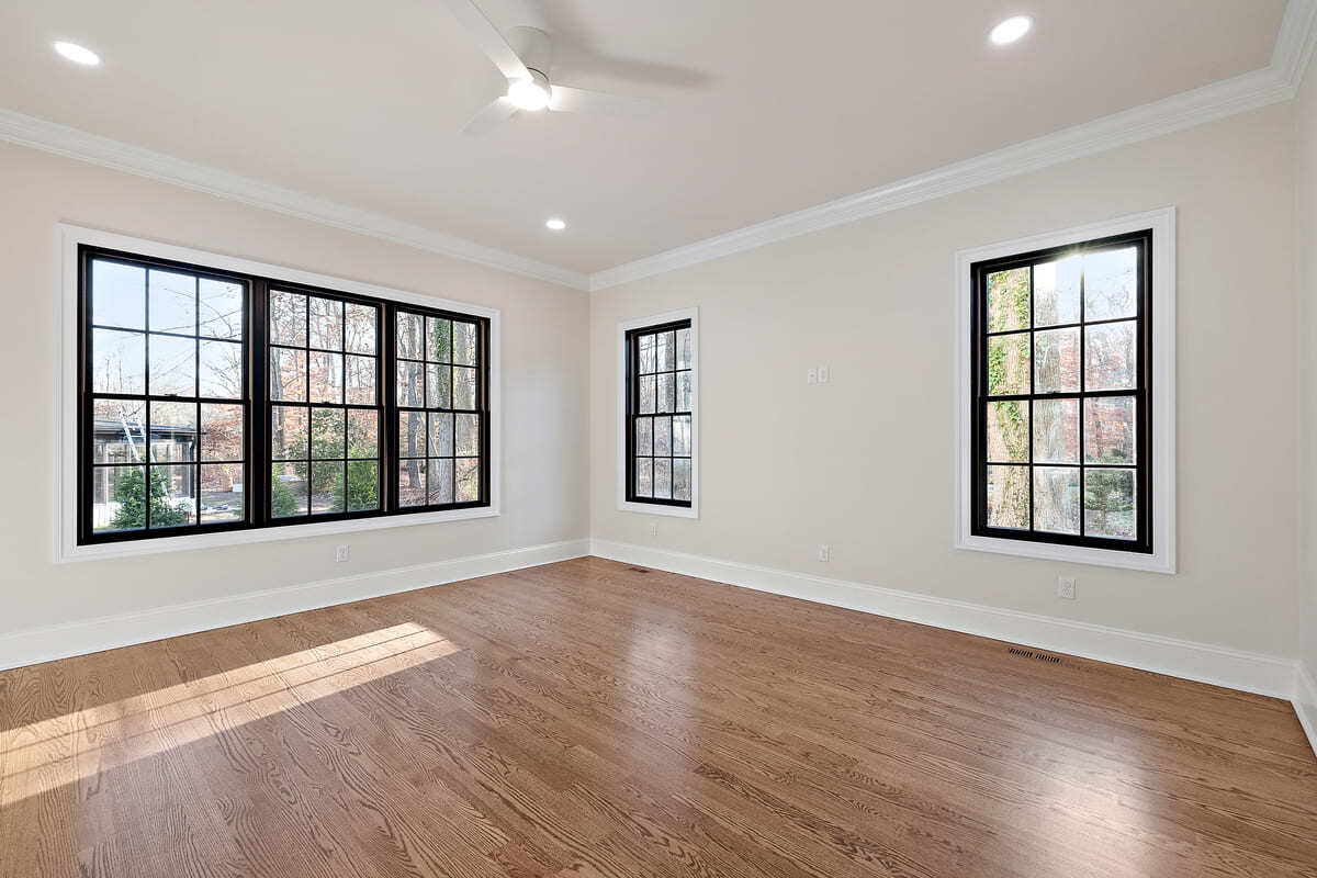 Hardwood flooring and black trim windows in Delaware custom home by Bromwell Construction