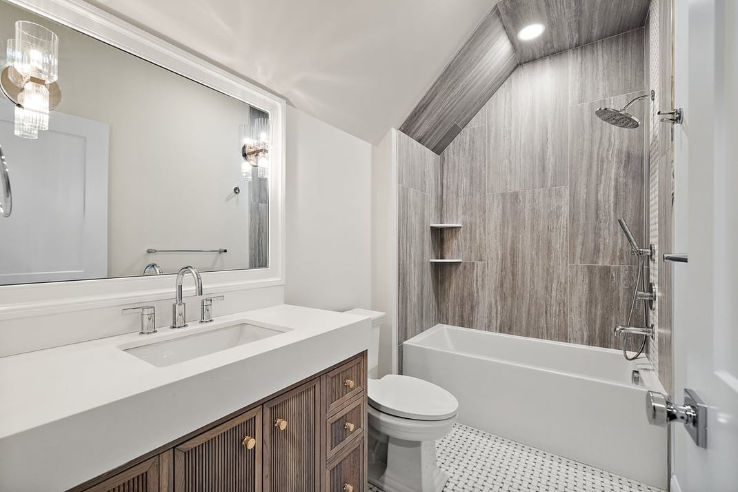 Bathroom with tub and shower combo in DE custom home by Bromwell Construction