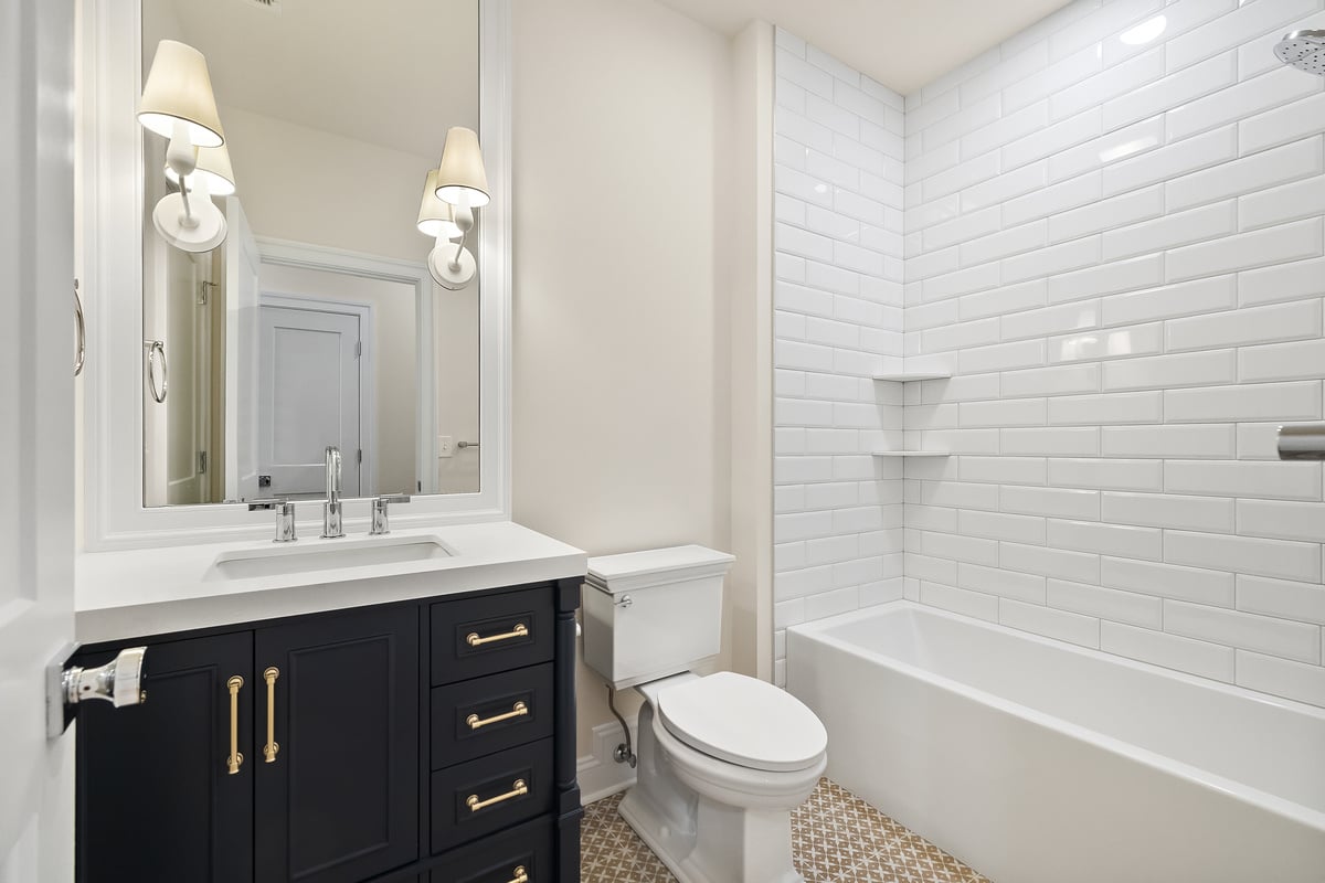 Guest bathroom in Delaware custom home with tub and shower combo by Bromwell Construction