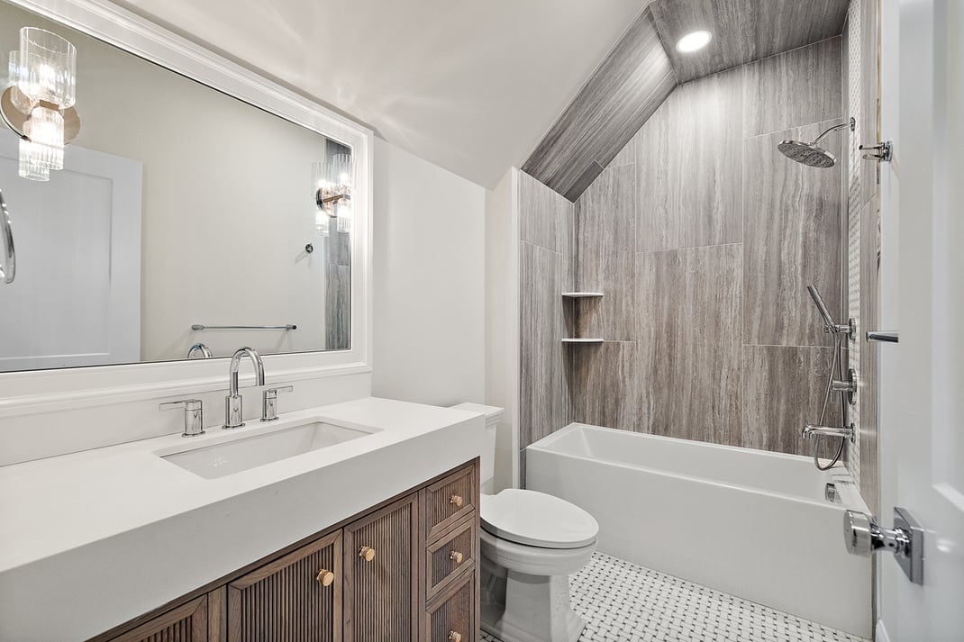 Bathroom with tub and shower combo in DE custom home by Bromwell Construction