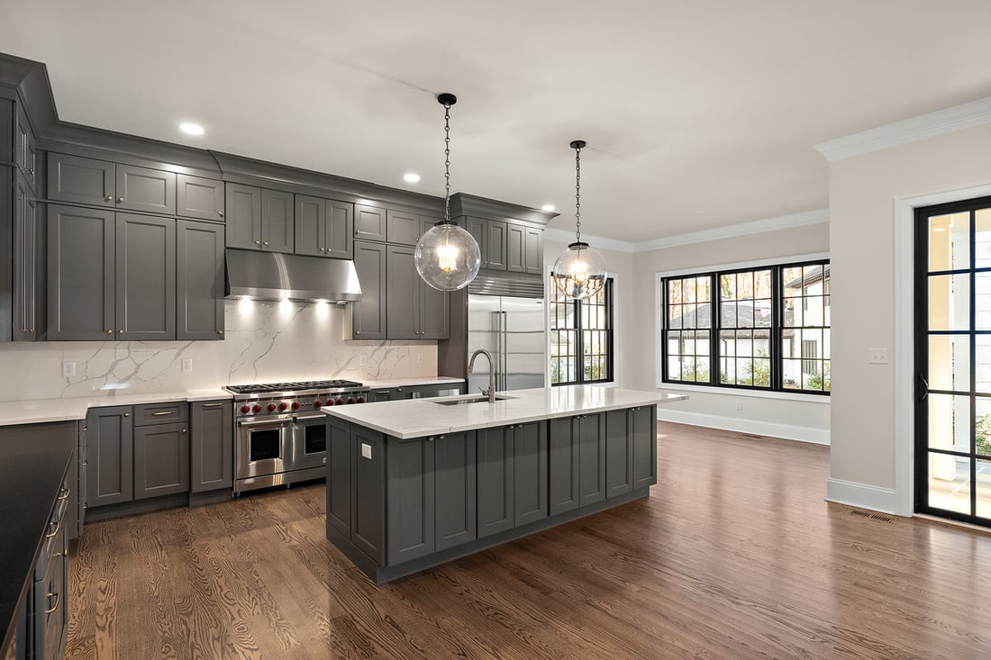 Kitchen in Delaware custom home with island by Bromwell Construction