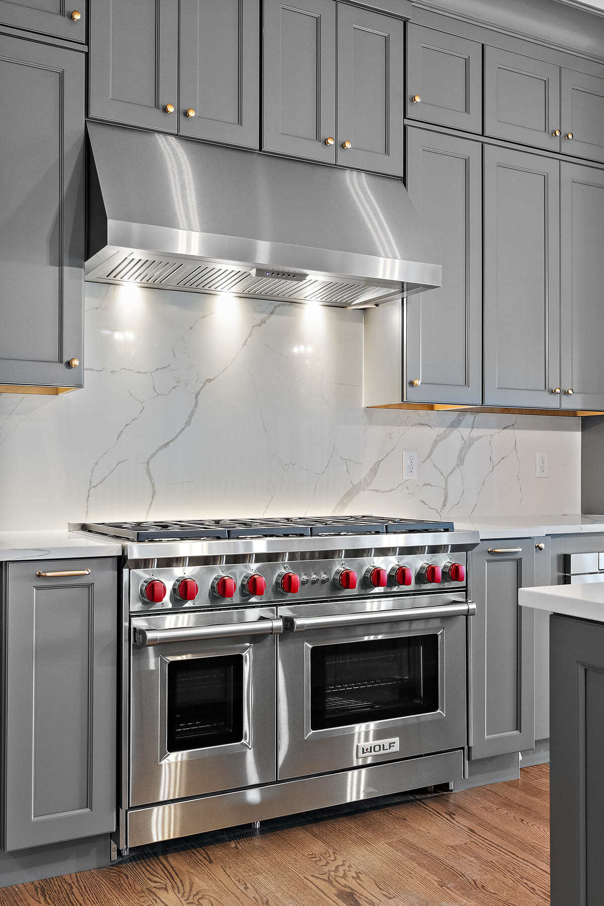 High-end oven range in front of slab backsplash in Delaware custom home by Bromwell Construction High-end oven range in front of slab backsplash in Delaware custom home by Bromwell Construction