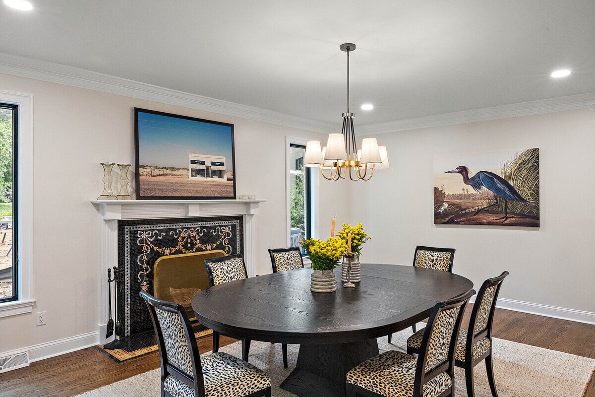 Dining room with custom fireplace surround in Wilmington, Delaware by Bromwell Construction