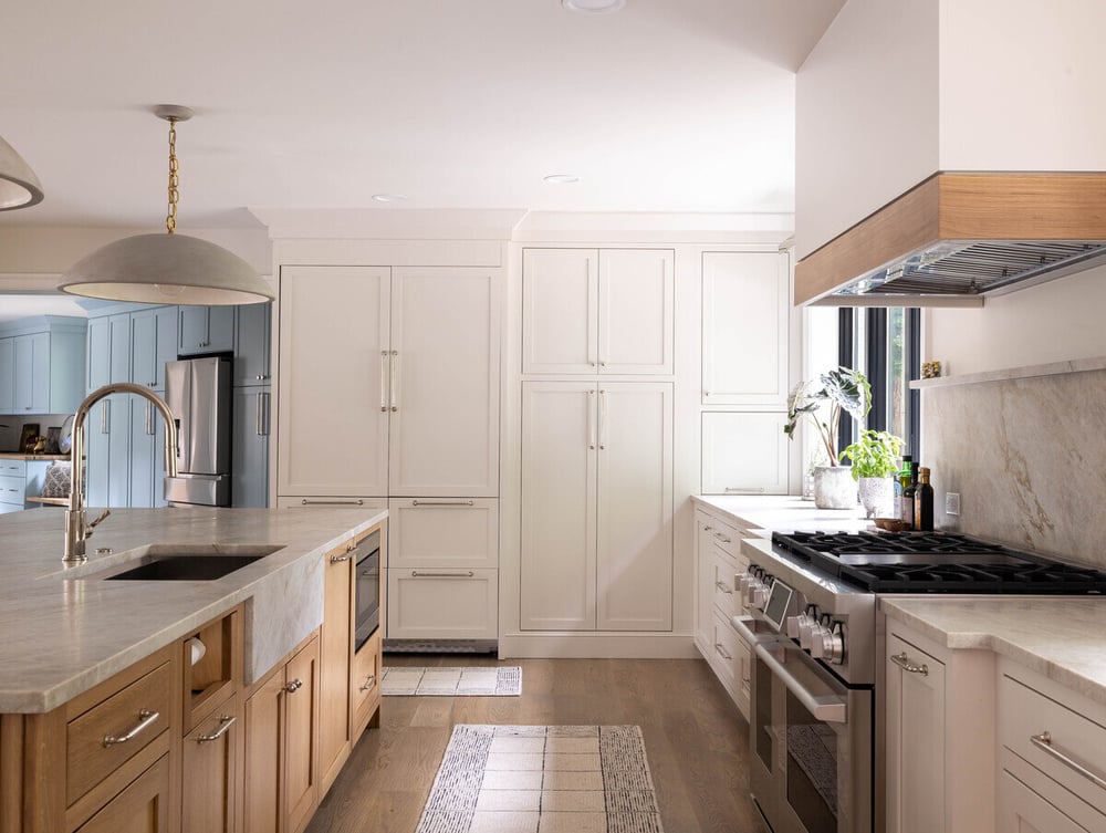 Kitchen remodel with white cabinetry in Delaware whole home remodel by Bromwell Construction