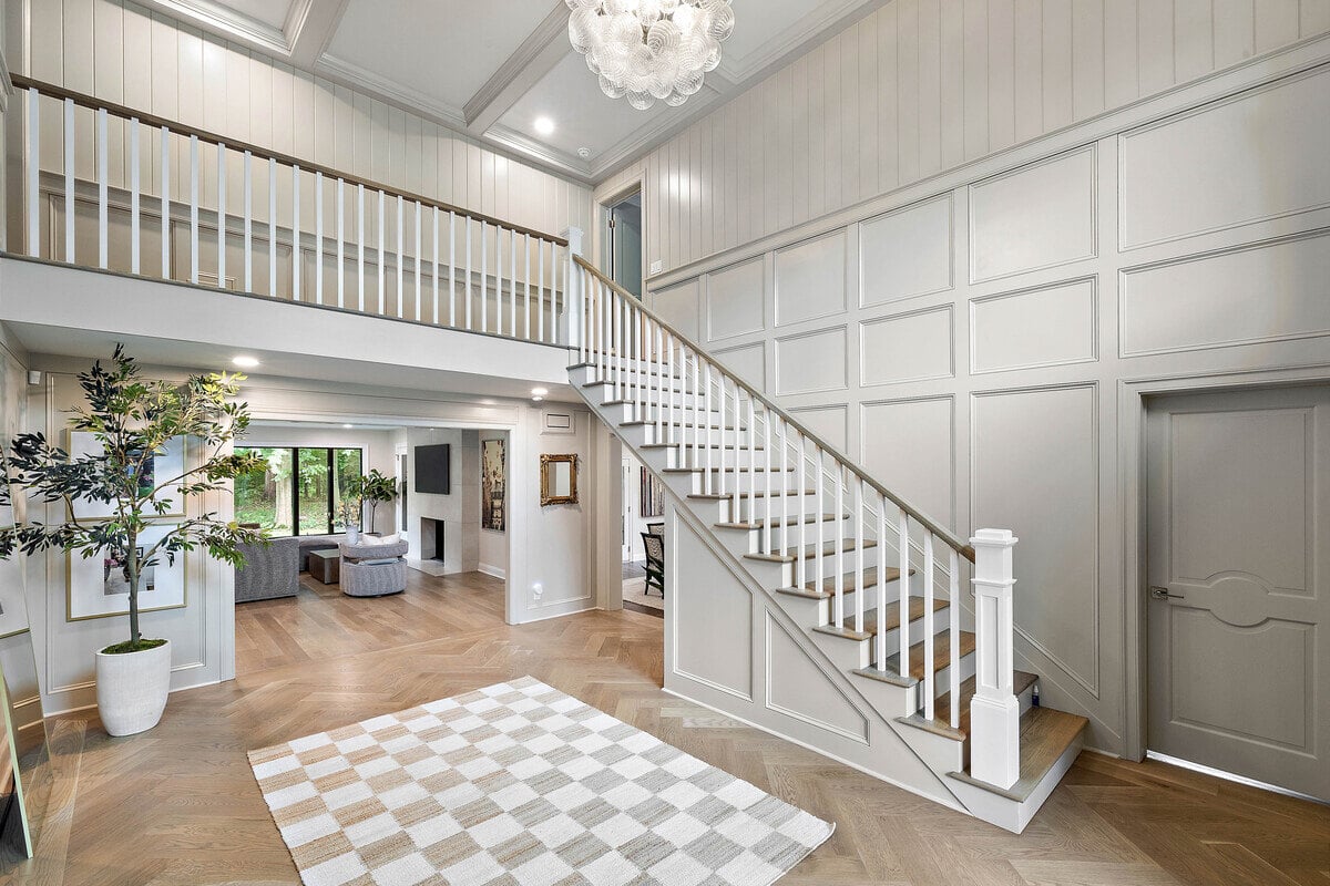 Staircase in foyer of home remodel in Delaware by Bromwell Construction