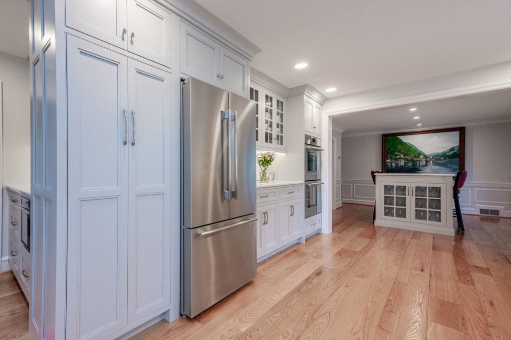 Kitchen remodel with floor-to-ceiling cabinetry and recessed lighting