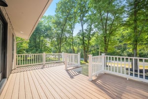 Custom back deck in Wilmington, Delaware with white posts