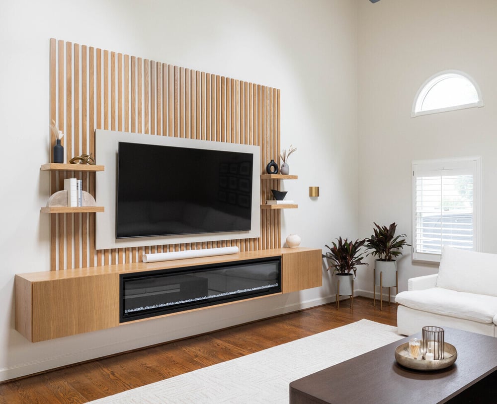 Custom living room with floating entertainment center in Delaware by Bromwell Construction