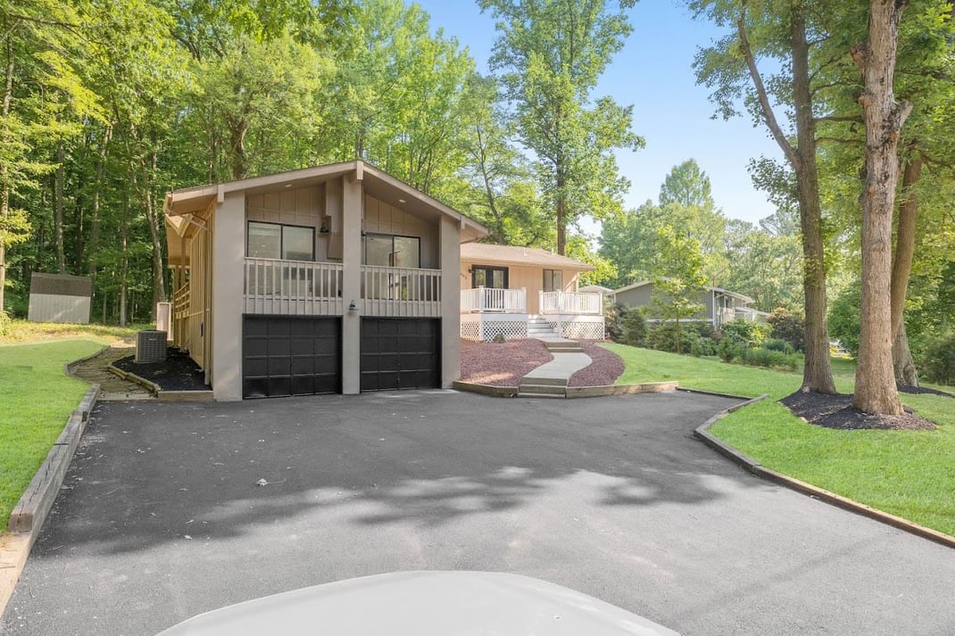 Custom two car garage addition with deck above in Delaware area