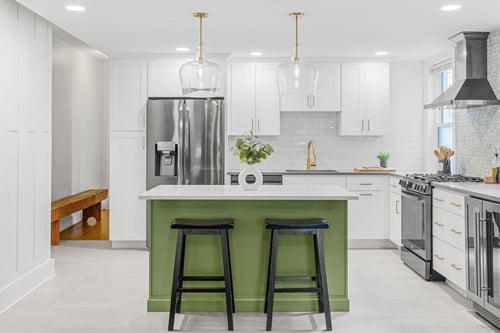 Delaware Kitchen remodel with white cabinetry and gold fixtures and view of island with green base-1