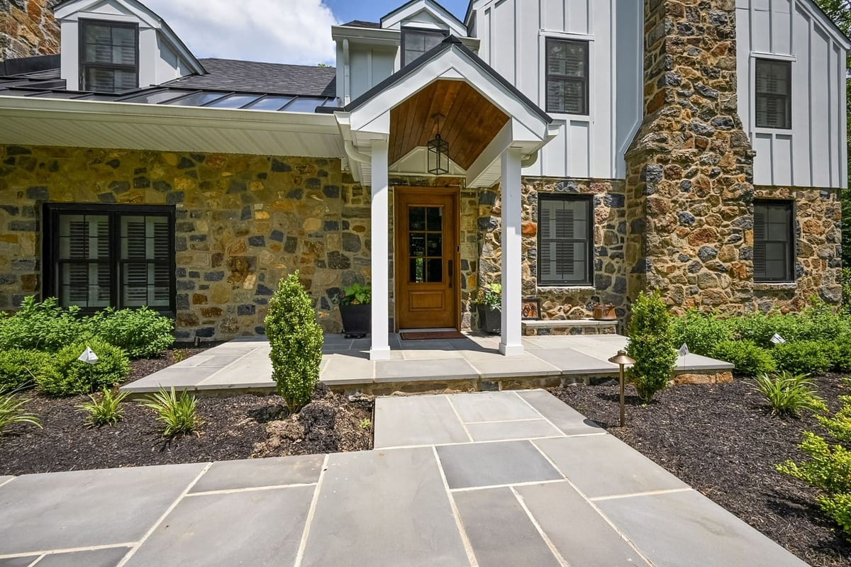Delaware custom home exterior with stone walkway to front door