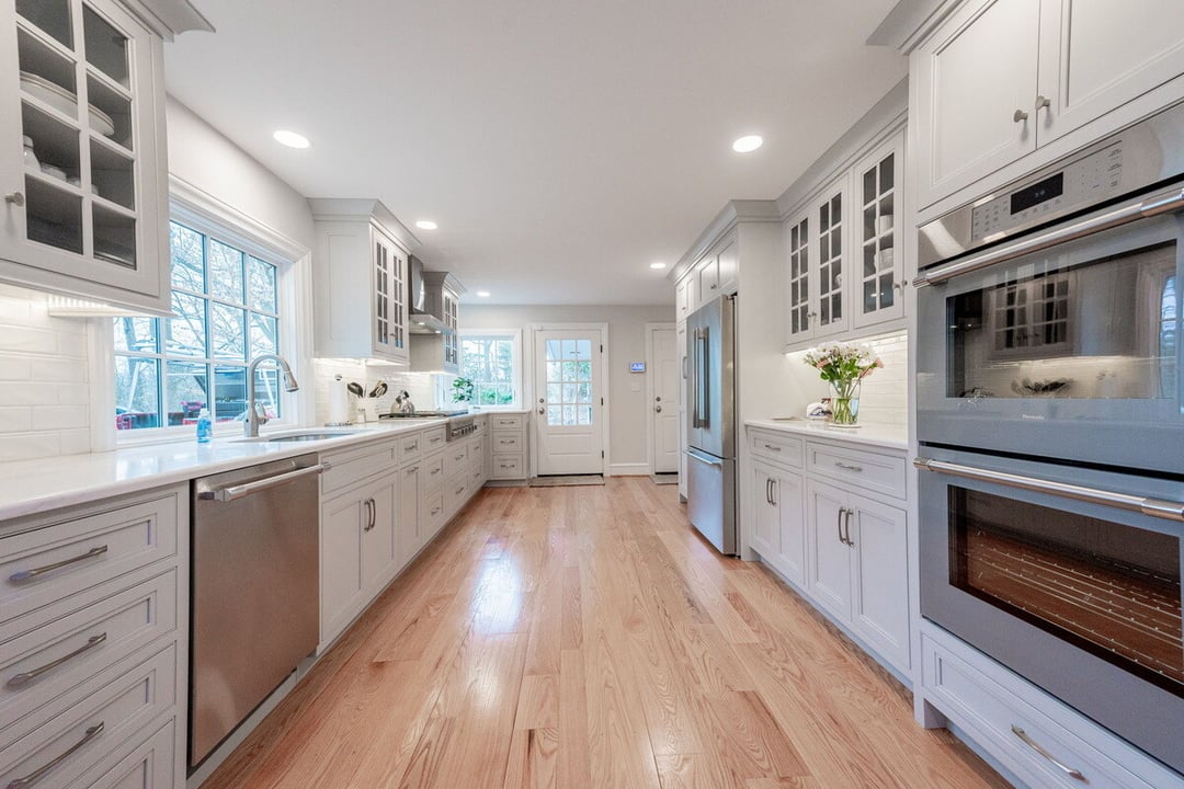 White kitchen remodel by Bromwell Construction with double oven