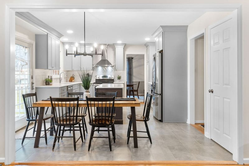 Delaware kitchen remodel with modern gray cabinets and pendant light above dining table