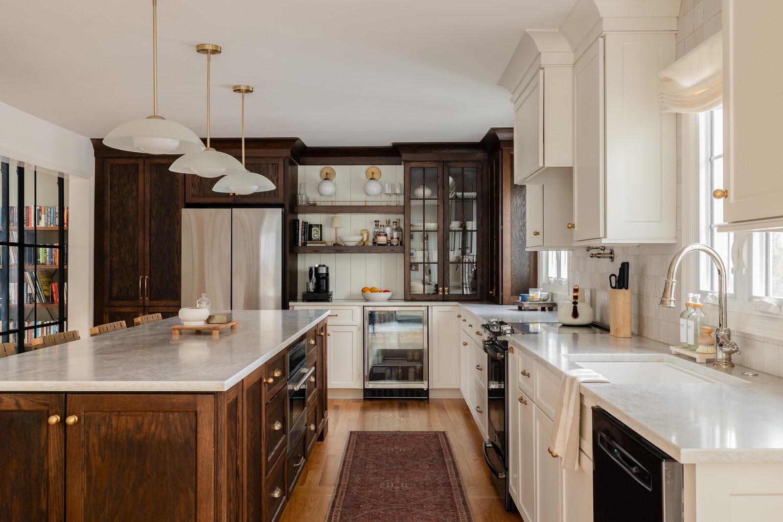 Kitchen view with island, built in bar, and farmhouse sink in Wilmington, DE, built by Bromwell Construction Kitchen view with island, built in bar, and farmhouse sink in Wilmington, DE, built by Bromwell Construction