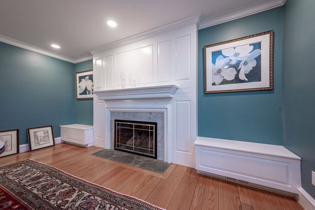 Family room in Wilmington, DE home remodel with fireplace and white surround