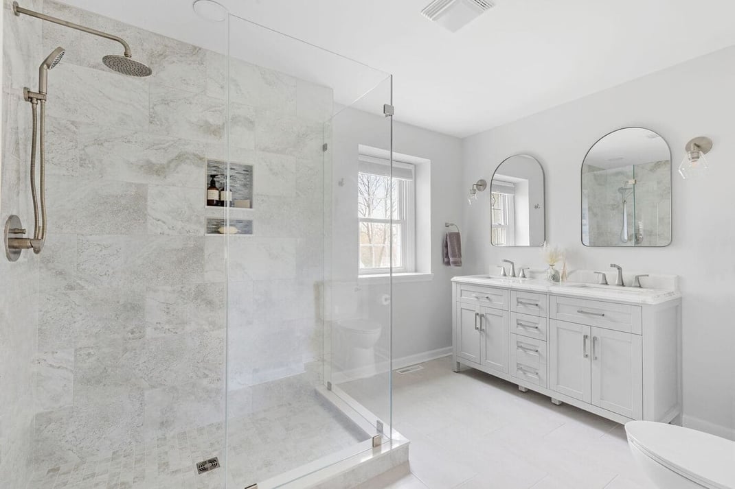 High-end master bathroom in Delaware remodel with double vanity and walk-in shower
