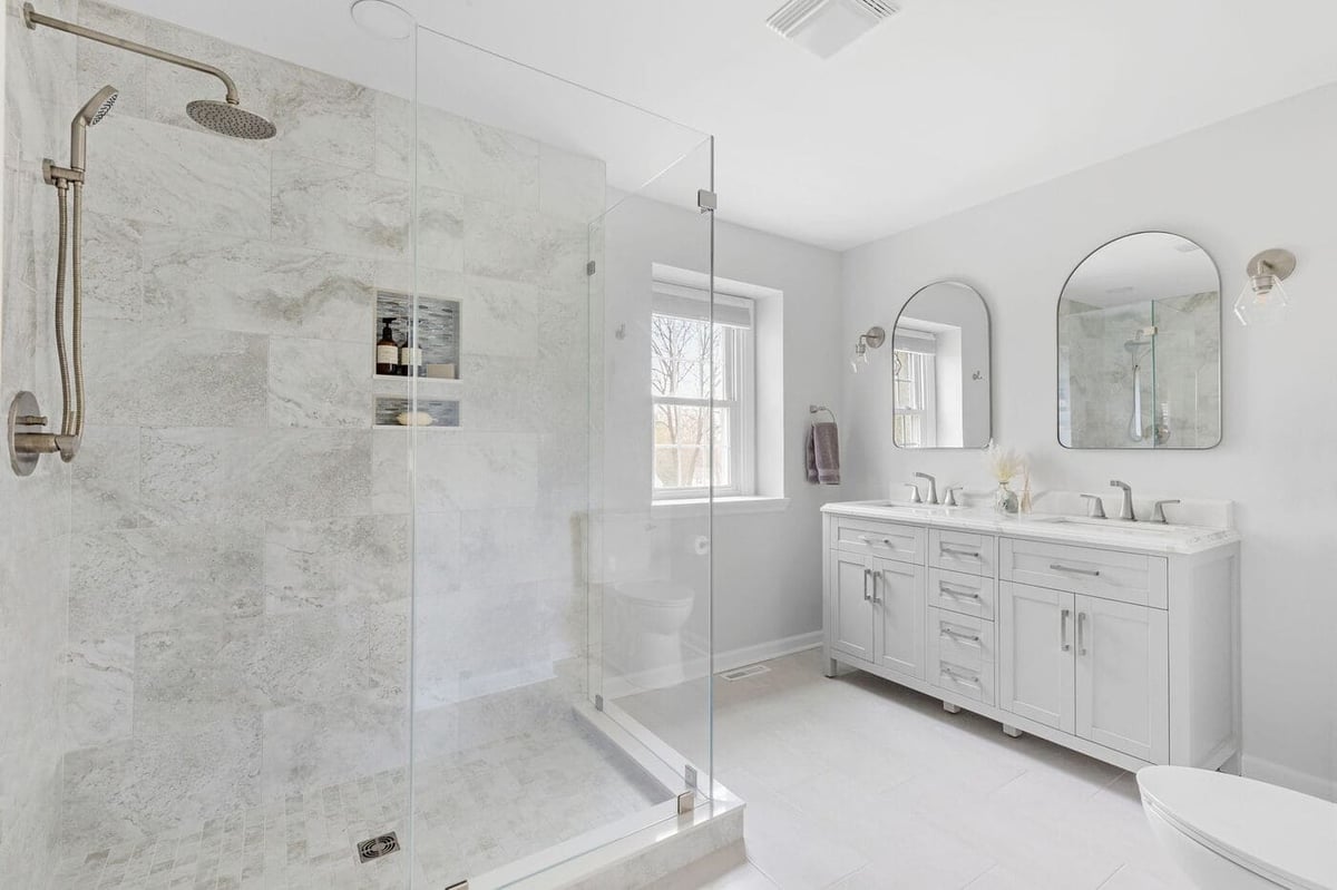 High-end master bathroom in Delaware remodel with double vanity and walk-in shower