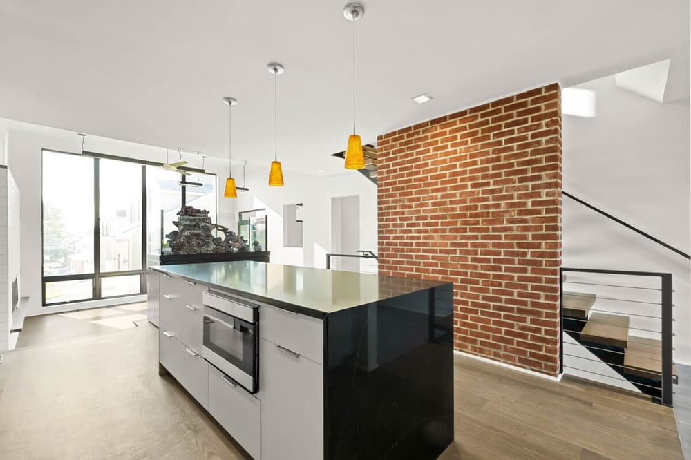 Kitchen island in Delaware custom home with microwave built-in