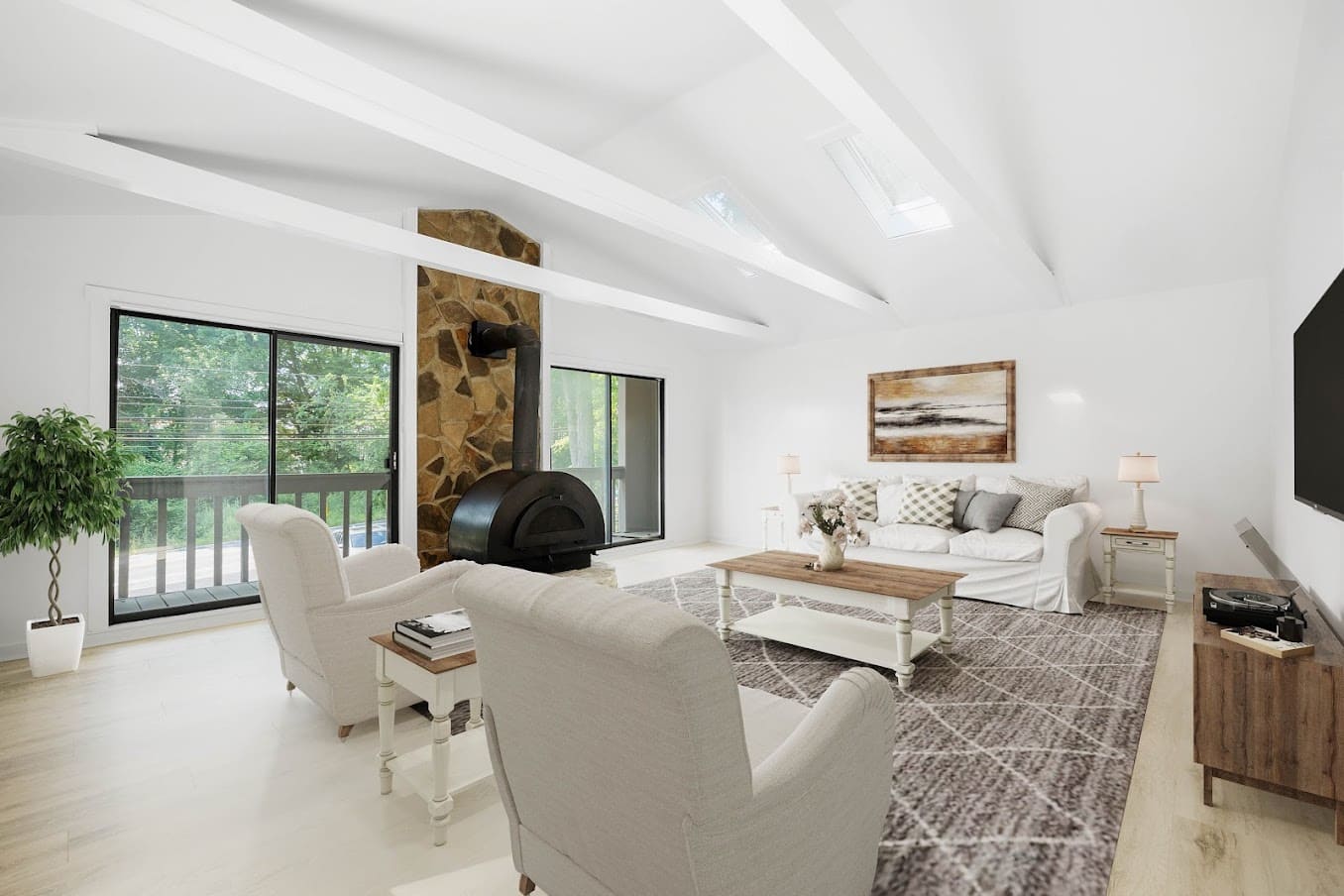 Modern living room interior with vaulted ceilings and stone fireplace in Delaware area
