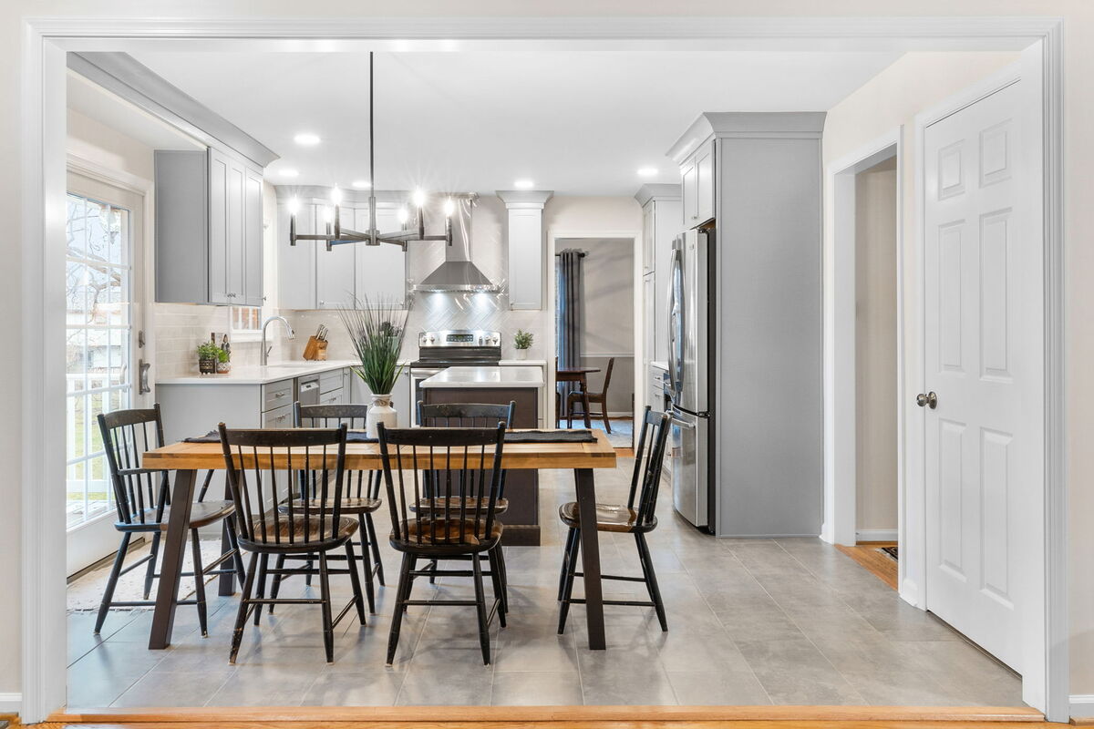 View of dining room in Wilmington, DE kitchen with pendant light above table