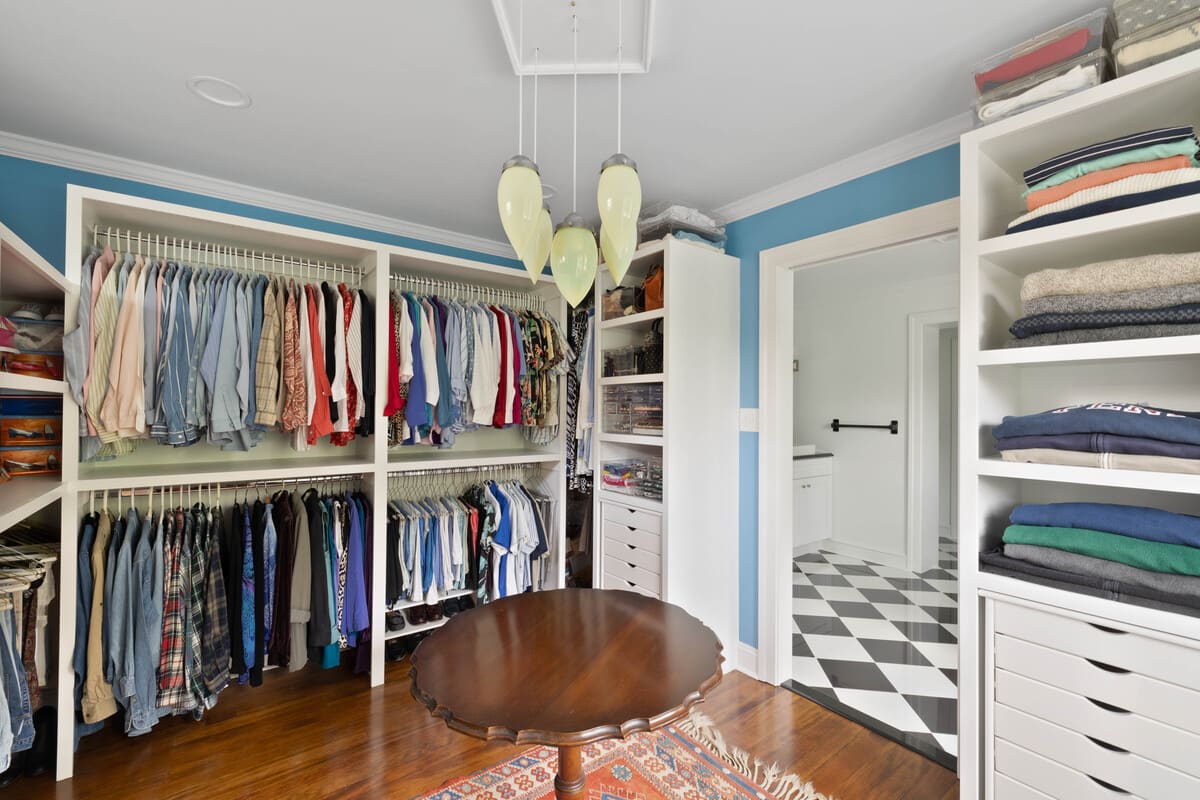 Walk-in closet with built-in clothing storage in Delaware home addition