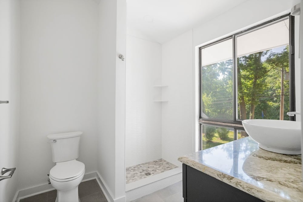 Wilmington, DE bathroom remodel with tile flooring and vessel sink with window