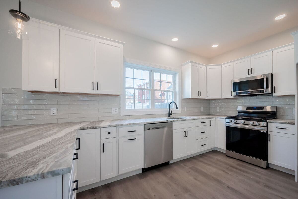 High-end kitchen remodel with white countertops