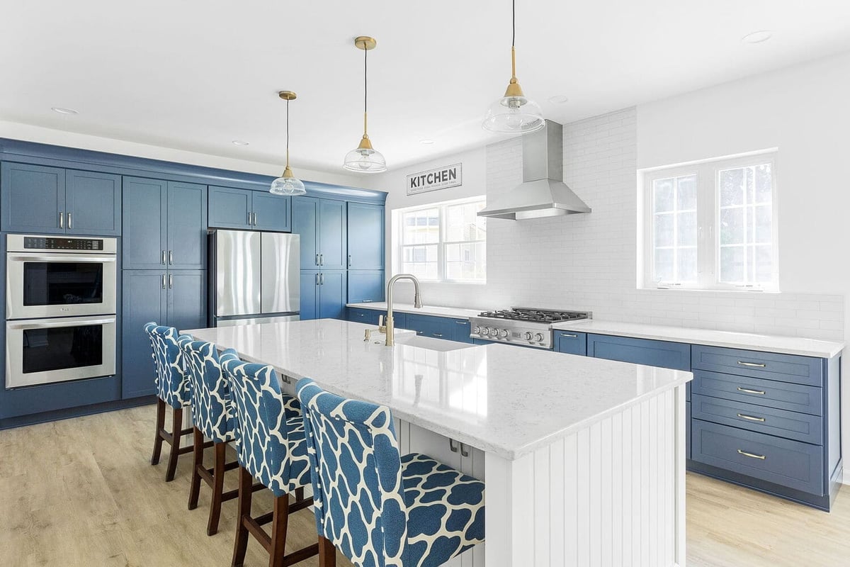 modern blue kitchen remodel with white kitchen island and seating