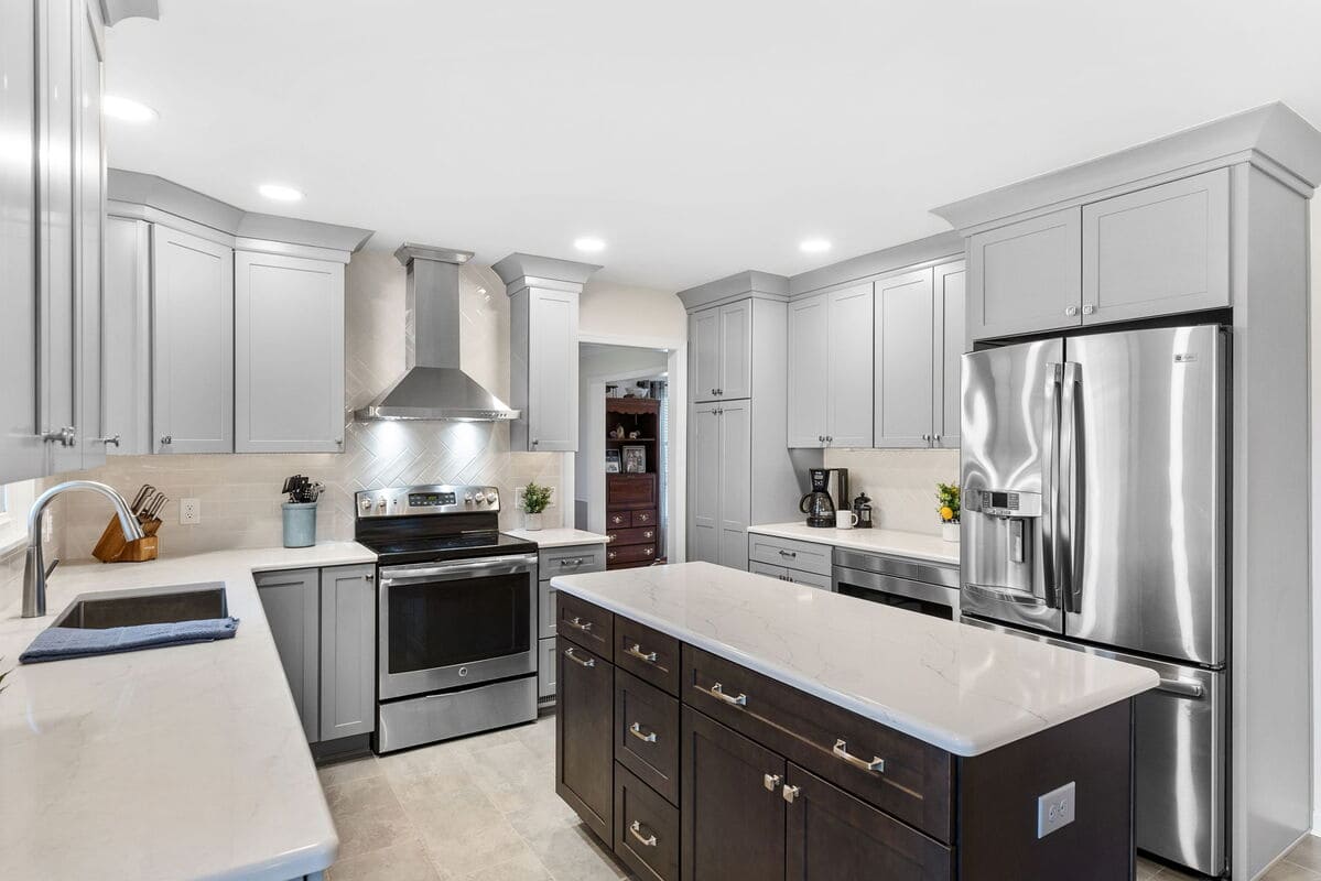 Modern kitchen remodel with recessed lighting and gray cabinets