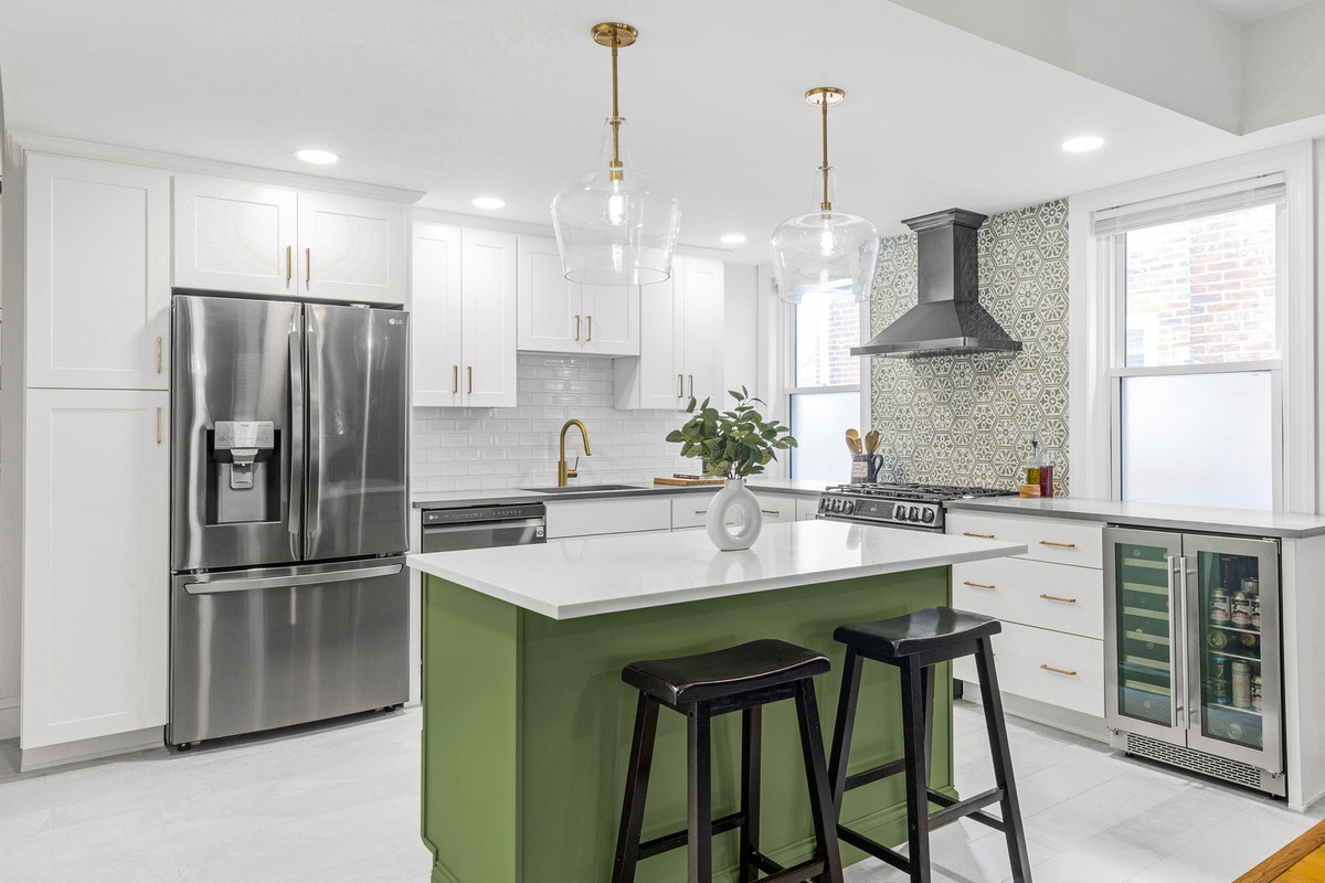 White kitchen in Delaware with a green island base