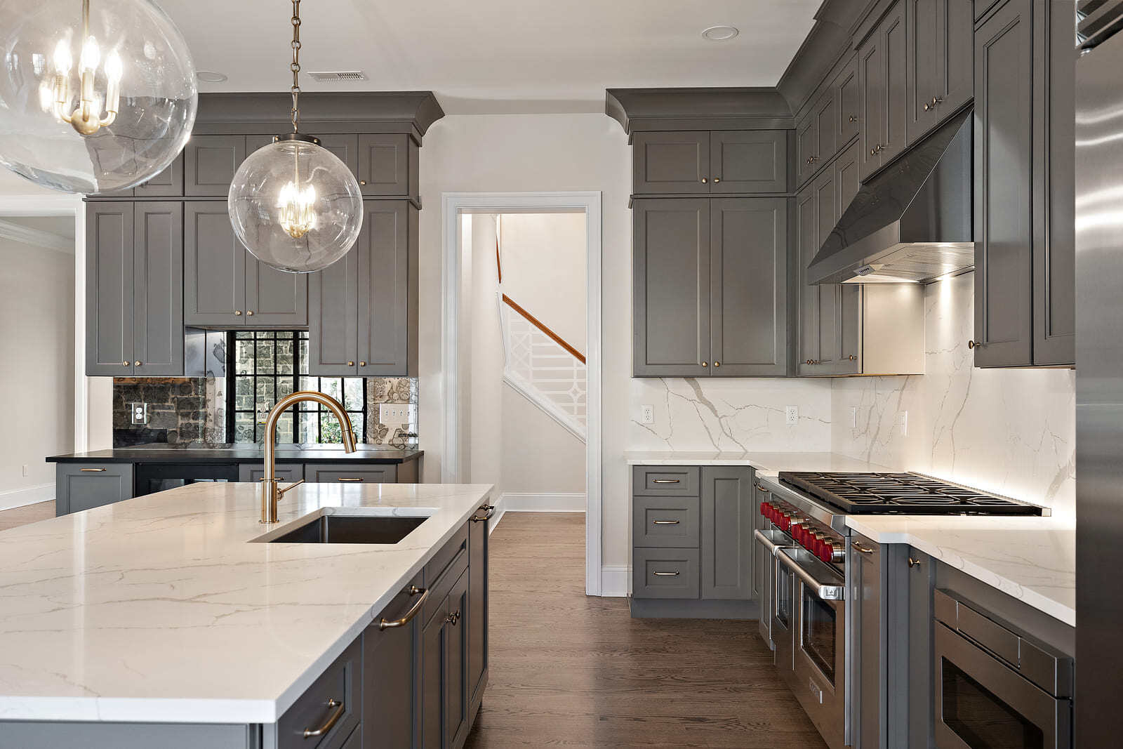 Delaware kitchen remodel with stone countertops and slab backsplash by Bromwell Construction