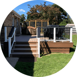 Wooden deck stairs with white and gray railings