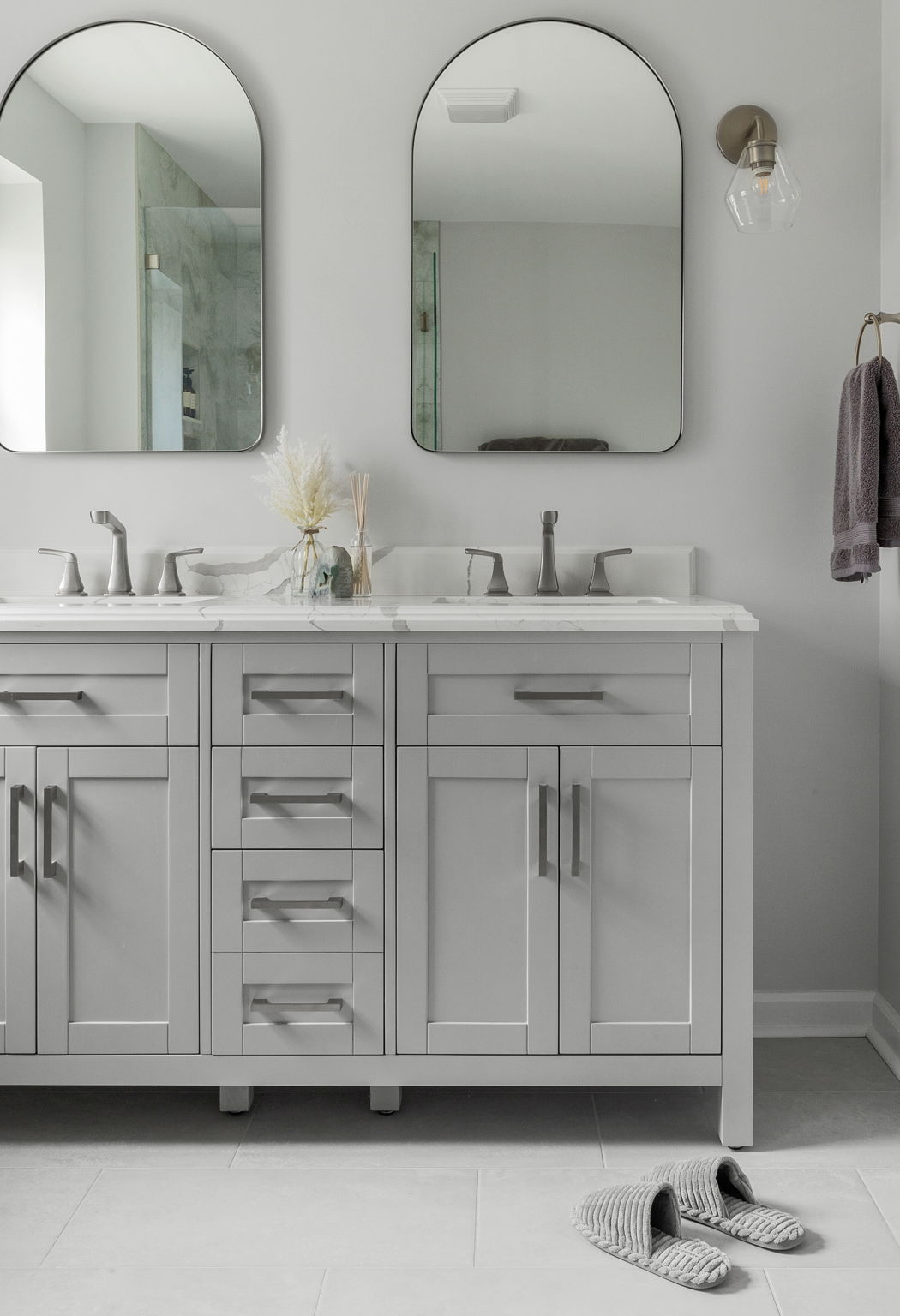 Double vanity with gray shaker cabinets and stone countertops in Delaware bathroom remodel Double vanity with gray shaker cabinets and stone countertops in Delaware bathroom remodel